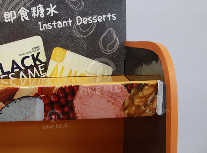 Close up of the plastic edge banding on the side of the cardboard display