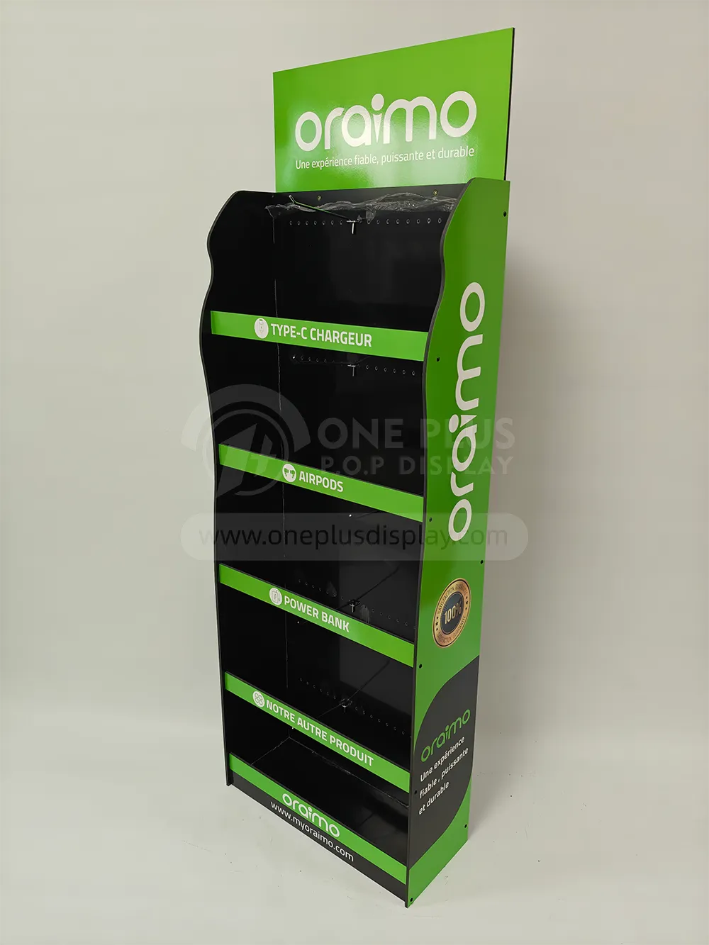 Finished custom black-and-green PVC foam board floor display stand with pegboard backing and metal hooks